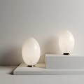 Stylish Egg Shaped White Table Lamps Placed On White Platforms With Light Colored Wall Background 3d model