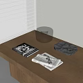 Black And White Circular Inflatable Device On Wooden Table With Magazine Towel And Gray Tray