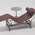 Burgundy Lounge Chair With Metal Frame And Round Concrete Side Table