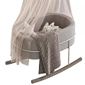 Gray Rocking Baby Crib With Metal Frame Wooden Rockers Star Patterned Pillows And Striped Blanket