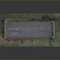 Red Vintage Building Featuring Gray Roof Grass Surroundings and Doors Windows