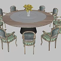 Round Dining Table Set With Green Patterned Chairs And White Plate Yellow Flowers
