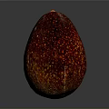 Red Avocado With Yellow Speckles On Glossy Skin Against Gray Background