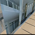 Modern Commercial Building Entrance With Revolving Glass Door Stone Walls And Steps