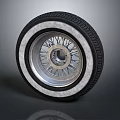 Tire With Silver Alloy Rim And Classic Spoke Design Black Tread Pattern