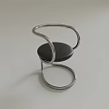 Modern Leisure Chair With Curved Metal Frame Black Cushion And Sleek Design