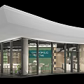 Modern Core Spaces Building With Glass Facade White Curved Roof Indoor Seating And Green Plants