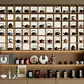 Tea Set Collection Featuring Neatly Arranged Teapots on Wooden Shelves with Accessories and Canisters