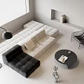 Modern Minimalist Living Room With Cream L Shaped Sofa And Black Round Coffee Table