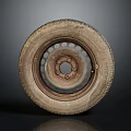 Old Worn Car Tire With Rusty Metal Rim On Dark Reflective Background