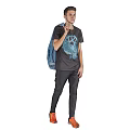 Man Walking With Blue Backpack Black T Shirt Blue Graphic Black Pants And Orange Shoes