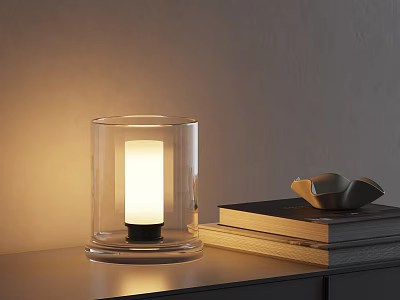 Lit Transparent Glass Table Lamp With Warm Light And Stacked Books On Tabletop 3d model