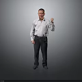 Man In White Shirt And Dark Pants Standing With Fist Raised Against Grey Background