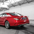 Red Mercedes-Benz Sedan Parked In Spacious Indoor Garage With Tire Tracks On Floor