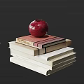 Still Life Stack of Assorted Books Topped with Bright Red Pomegranate