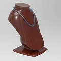Elegant Blue Beaded Necklace Displayed On Brown Wooden Bust Mannequin Stand