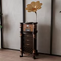 Vintage Gramophone On Dark Wooden Carved Cabinet With Green Plants And Textured Gray Wall