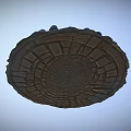 Ancient Circular Stone Labyrinth Structure With Decorative Carvings Grass Patches And Surrounding Stones