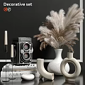 Decorative Ornament Set With Vintage Camera Pampas Grass White Vases Books Candles And Black Wall