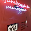 Colorful Neon Decorative Lights Featuring Welcome Letters in Café Bar Red Wall