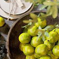 Fresh Decorative Arrangement With Limes In Wooden Bowl Blackberries Candle And Green Leaves