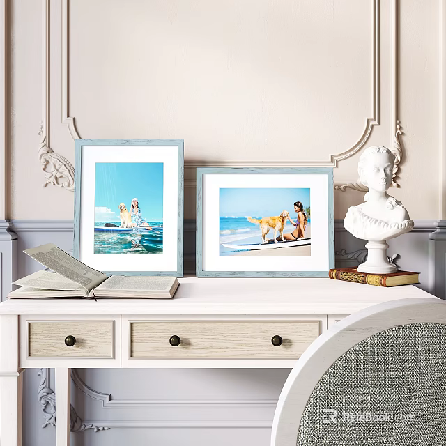 Elegant Blue Frames With Beach Photos On White Desk With Open Book And Bust Statue 3d model 