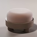Contemporary Round Ottoman with Soft Light Pink Cushion and Natural Wooden Legs Design