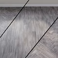 Modern Gray Wooden Floor Components With Herringbone Pattern And Black Divider Lines