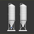 Three Silver Storage Tanks With Brown Conical Object On Metal Platforms
