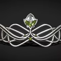 Elegant Silver Tiara Featuring Curved Design Floral Motif And Green Gemstone Inlaid