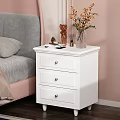 White Nightstand with Three Drawers Doll Red Bow Table Lamp and Books in Pink Bedroom