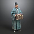 A Man In Traditional Blue Robe With Hat Holding Decorative Wooden Box