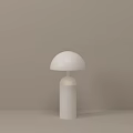White Minimalist Table Lamp With Dome Shade And Cylindrical Base On Light Brown Background