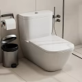 Modern White Toilet with Silver Waste Bin Toilet Paper Holder Tile Wall and Shower Area