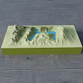 Green Mountain Terrain Commercial Equipment With Blue Water Flow Lines On Dark Wooden Floor