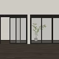 Modern Black Sliding Glass Doors With Green Plant And Wooden Floor