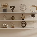 Elegant Metallic Decorative Ornaments Set With Geometric Shapes On White Shelves