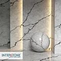 Elegant Marble Structure With Textured Walls And Spherical Decorative Element