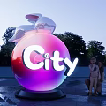 Giant Purple Sphere With City Sign Rabbit Sculpture Parent Child Observing In Outdoor Park