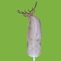Light Colored Deer With Antlers Bending Head On Green Background