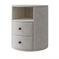 Modern Round Bedside Table With Two Drawers And Black Knobs In Beige Upholstered Fabric