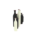 Black and White Ceramic Vases with Various Sizes and Shapes Arranged on Gray Background