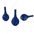 Three Blue Ceramic Vases With White Patterns Slender Neck Round Body One Lying On Side