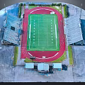 Aerial View of Stadium With Green Football Field Red Track and Seating Stands