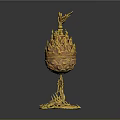 Golden egg shaped decorative ornament set with bird on top and intricate base design