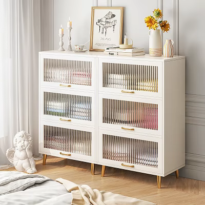 White Entryway Side Cabinet With Vertical Striped Drawers Gold Handles And Decorative Items On Top 3d model
