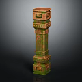 Decorative Column With Green Brown Textured Surface And Ornamental Carved Details