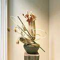 Decorative Ceramic Vase With Dried Plants Red Leaves And White Circular Decorations