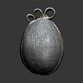 Metallic Textured Oval Household Item With Two Ring Decorations On Top