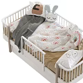 Cozy White Baby Crib With Wooden Legs Soft Pillows Plush Rabbit Toys And Gray Blanket